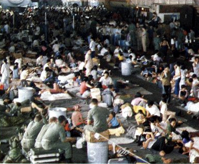 Vietnamese_refugees_in_hangar_of_USS_Hancock_%28CVA-19%29_1975.jpg